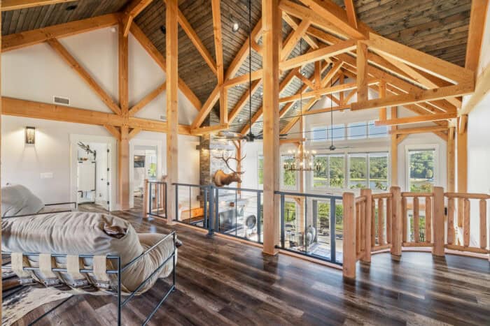 Elegant timber frame home with natural materials, mountain views, and open interior design showcasin.