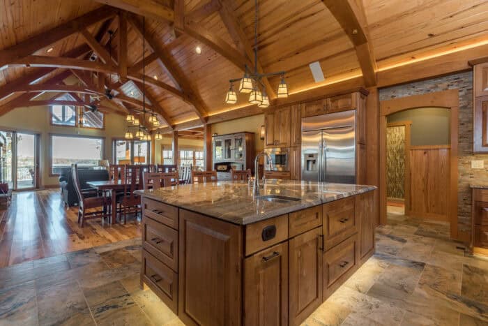 Elegant kitchen with wooden accents and vaulted ceilings in a natural element home.